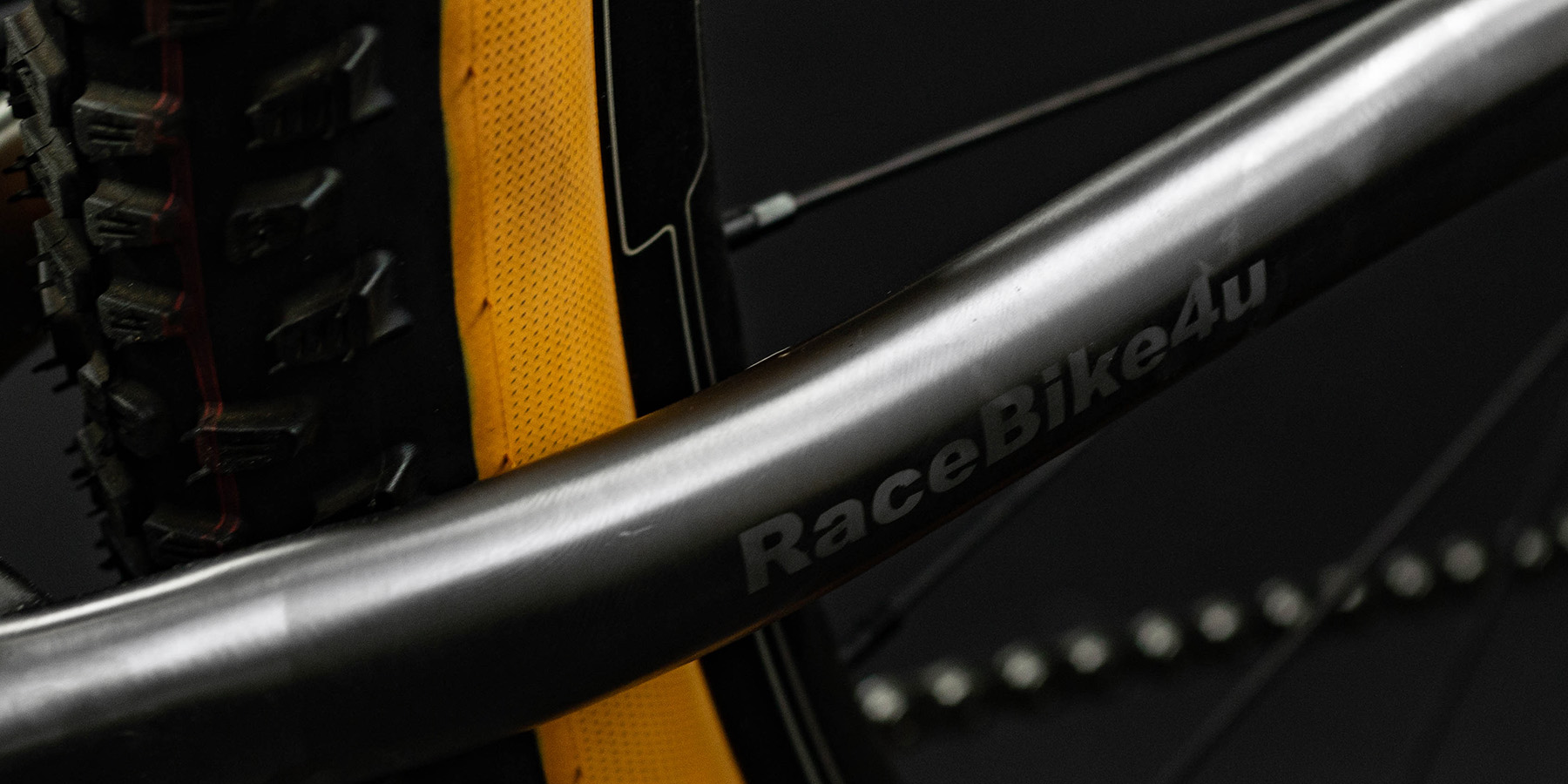The RaceBike4U Logo on a titanium chainstay